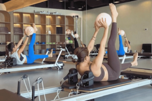 Woman practicing reformer Pilates at Antara Yoga and Pilates studio in Abu Dhabi